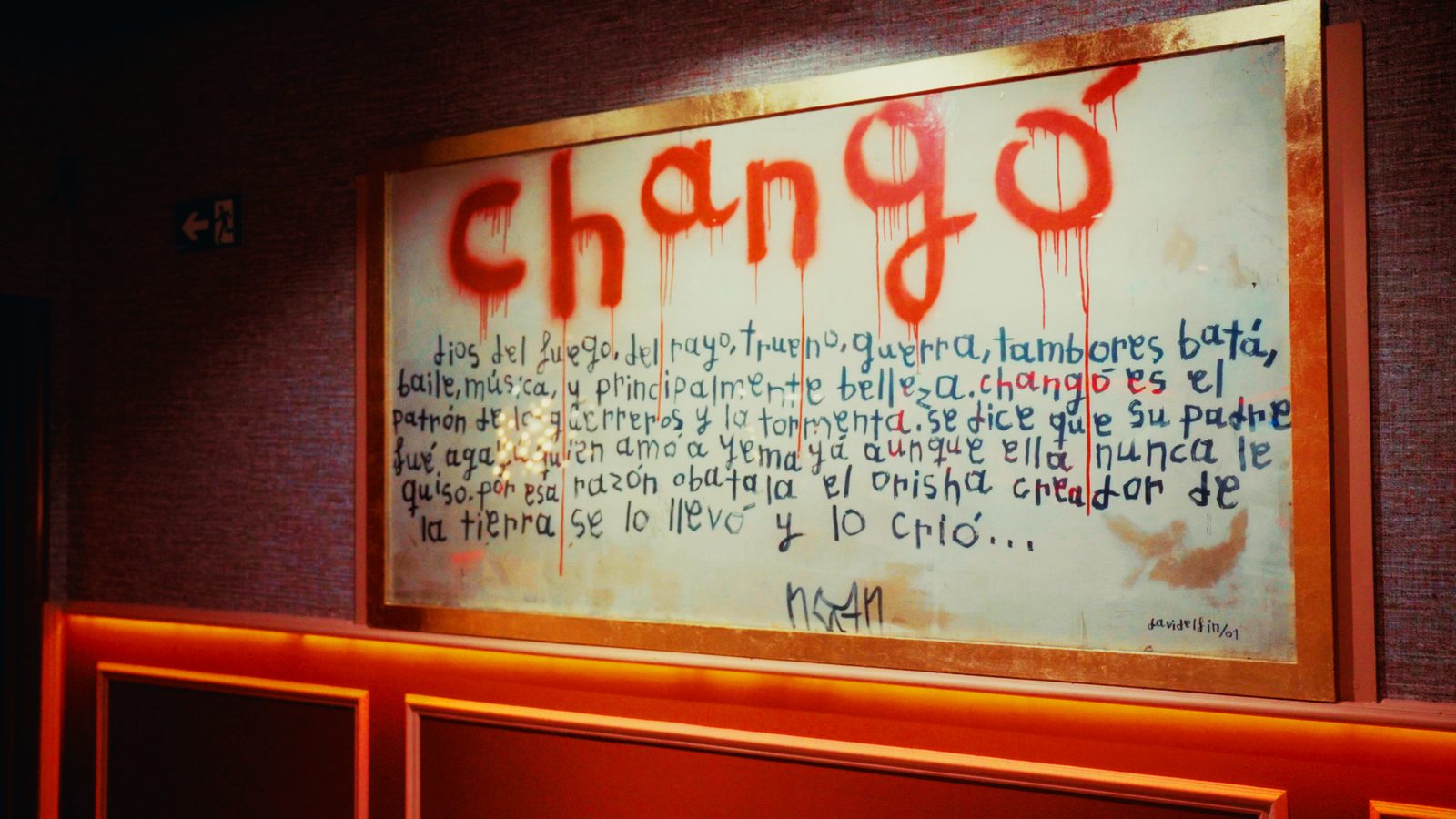 Cuadro de CHANGO con el nombre pintado en rojo, texto manuscrito y la firma “davidelfin /01”